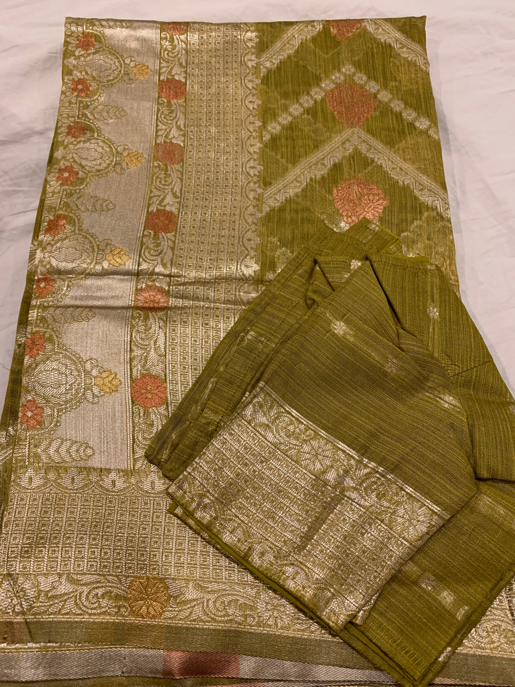 Banarasi linen saree with zari border with matching stitched blouse.