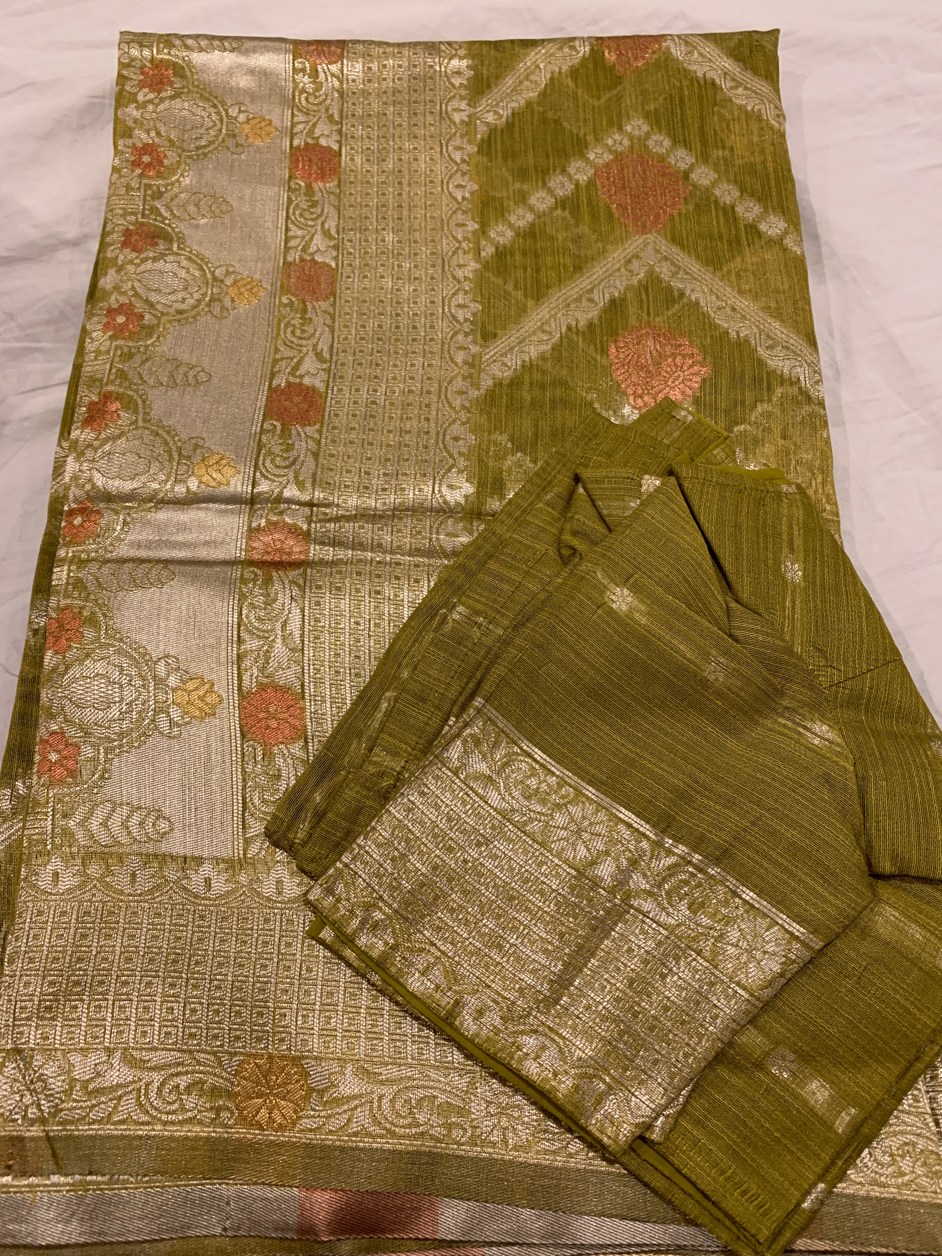 Banarasi linen saree with zari border with matching stitched blouse.